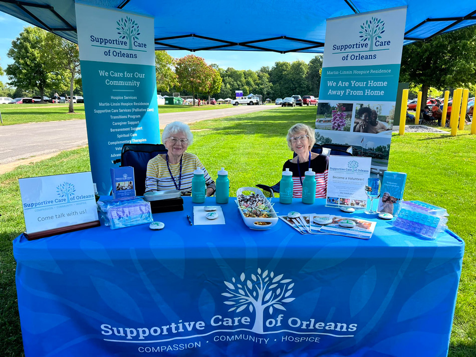 Supportive Care of Orleans representatives at an informational booth